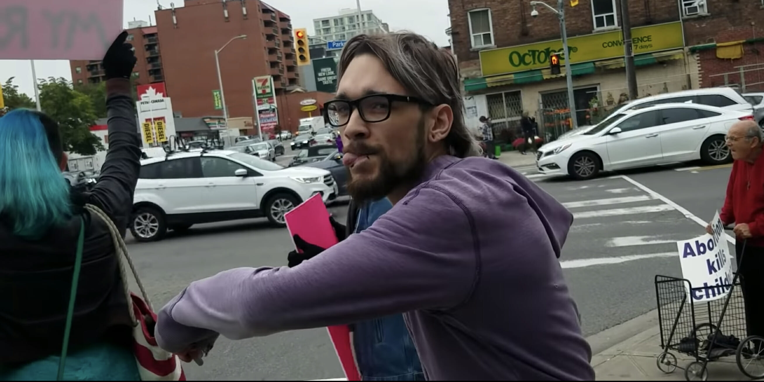 A hairstylist was fired after a video of him kicking a woman at an anti-abortion rally went viral.