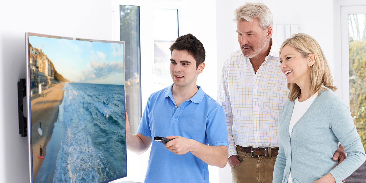 man adjusting motion smoothing on television