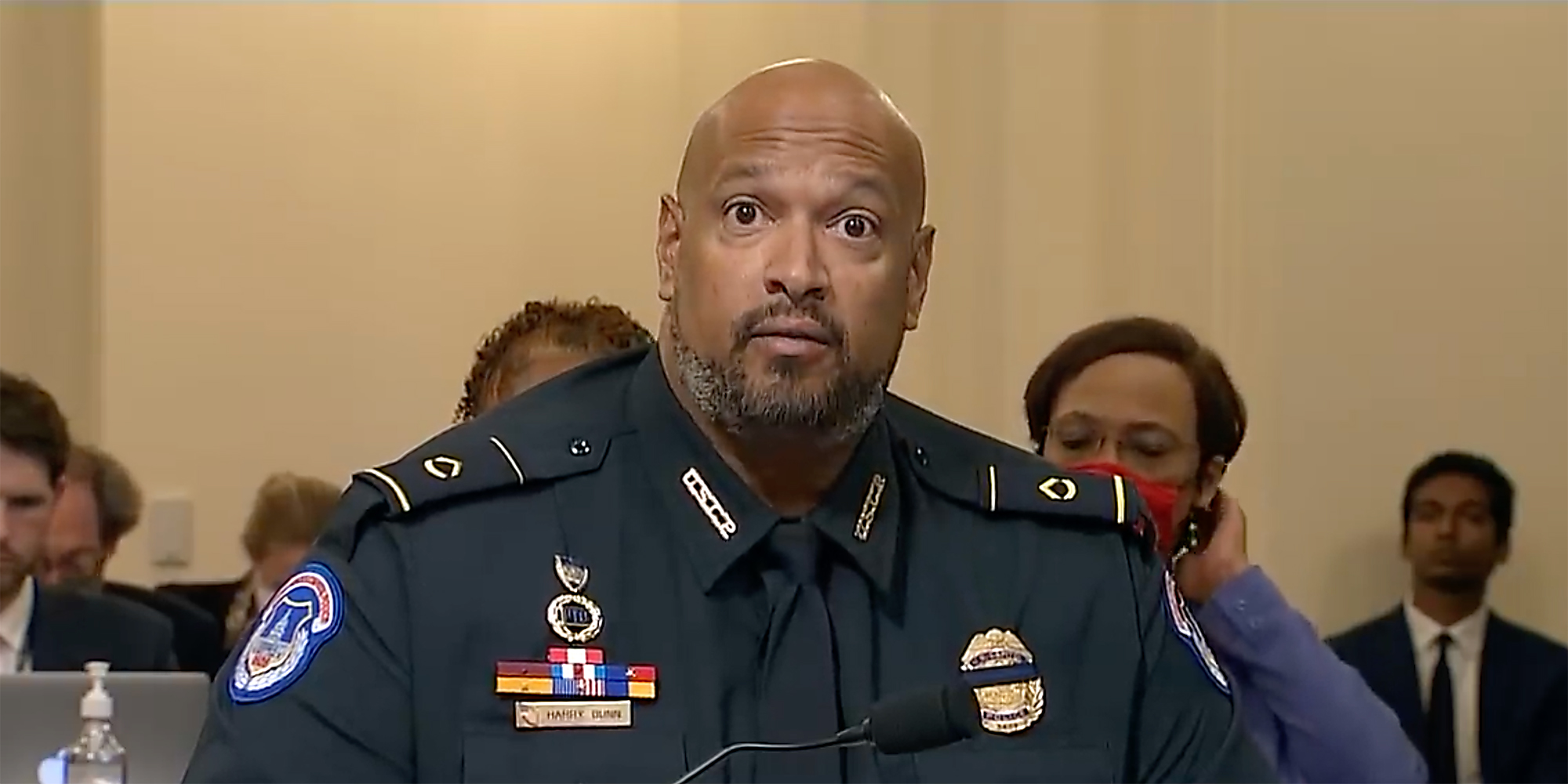 A police officer giving a deposition.