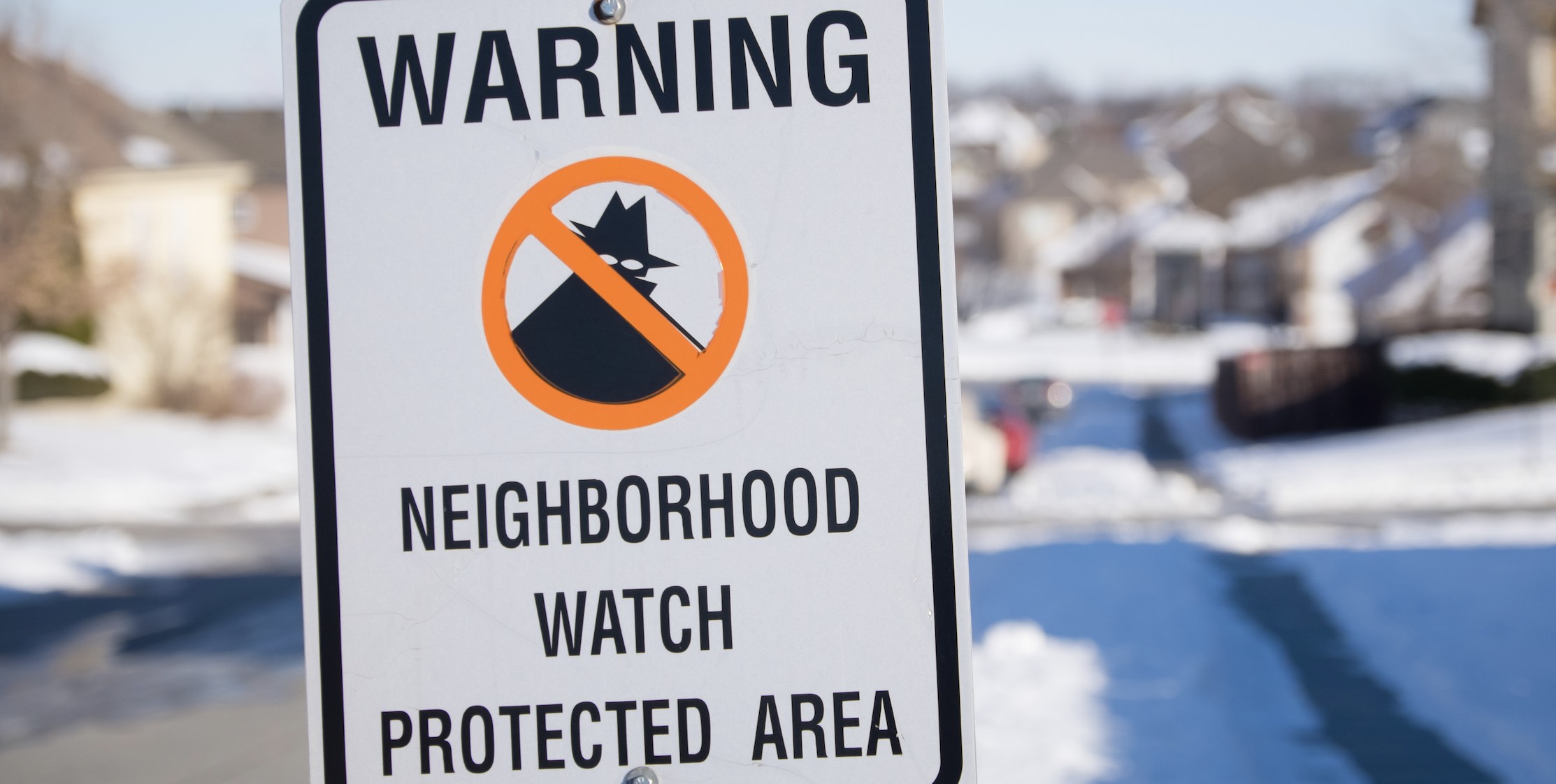 neighborhood watch sign in the snow
