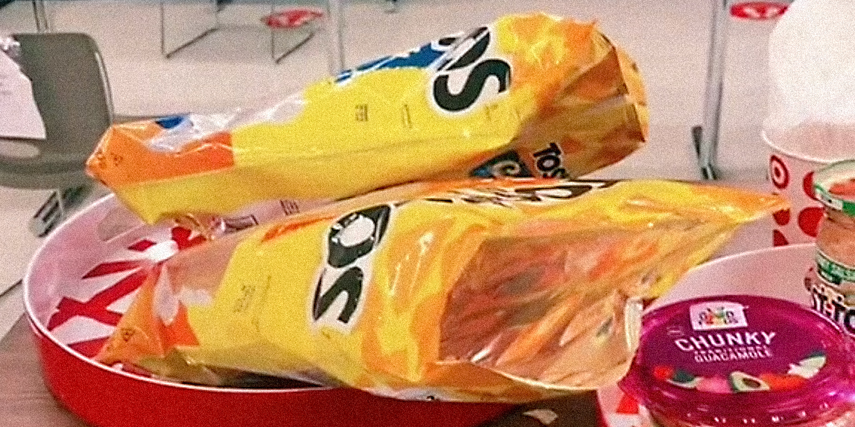 Chips and dips on a table.