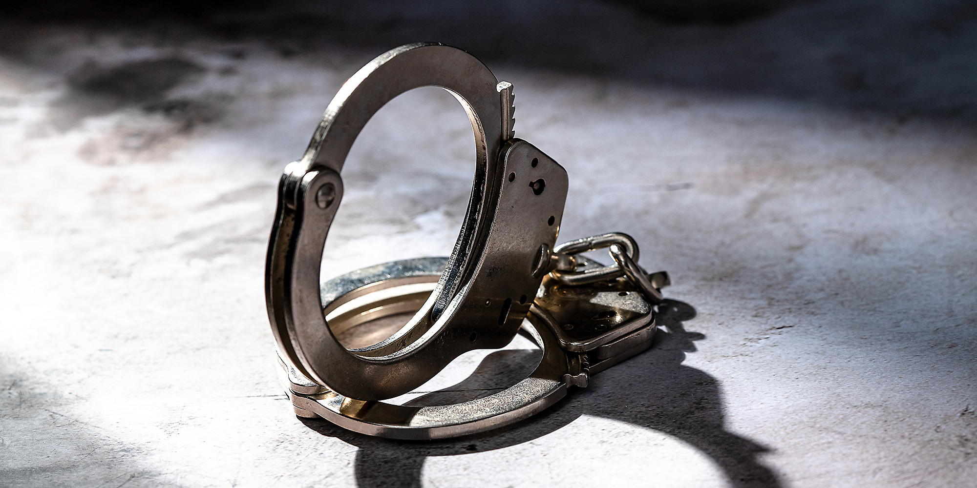 Handcuffs on the ground.