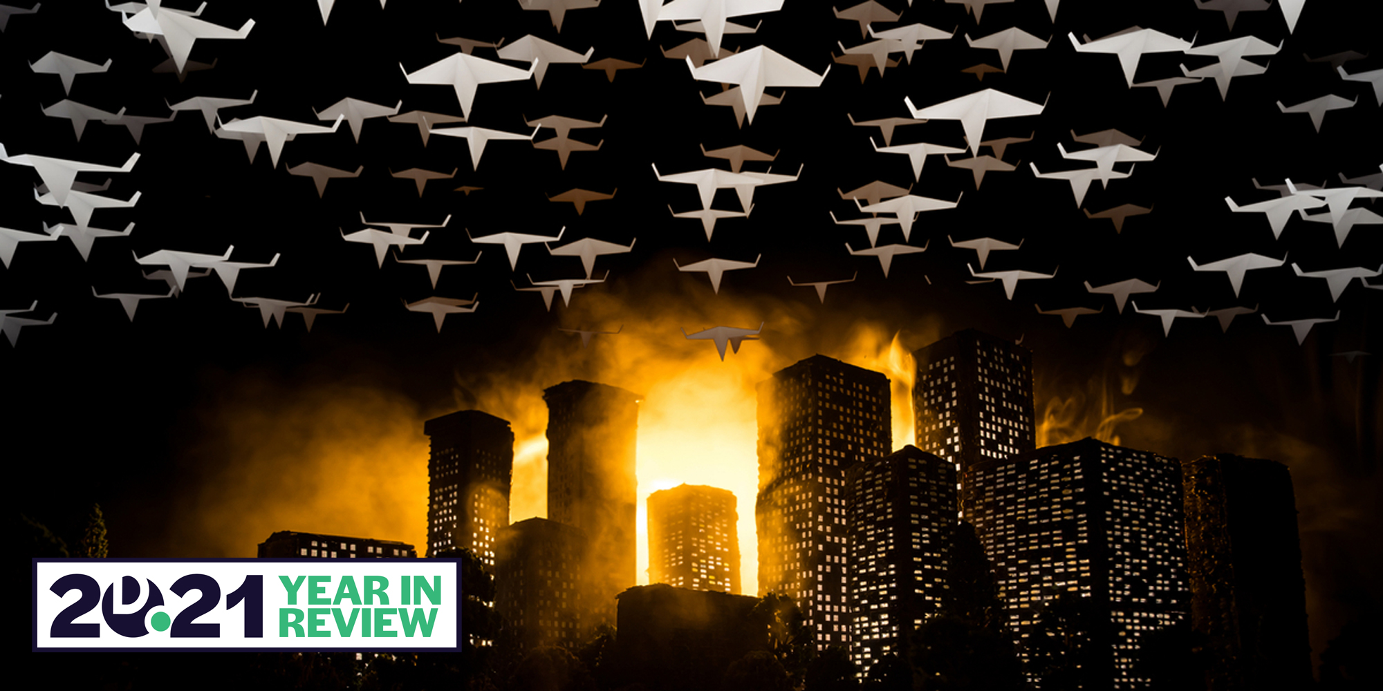 paper planes bombing a city at night