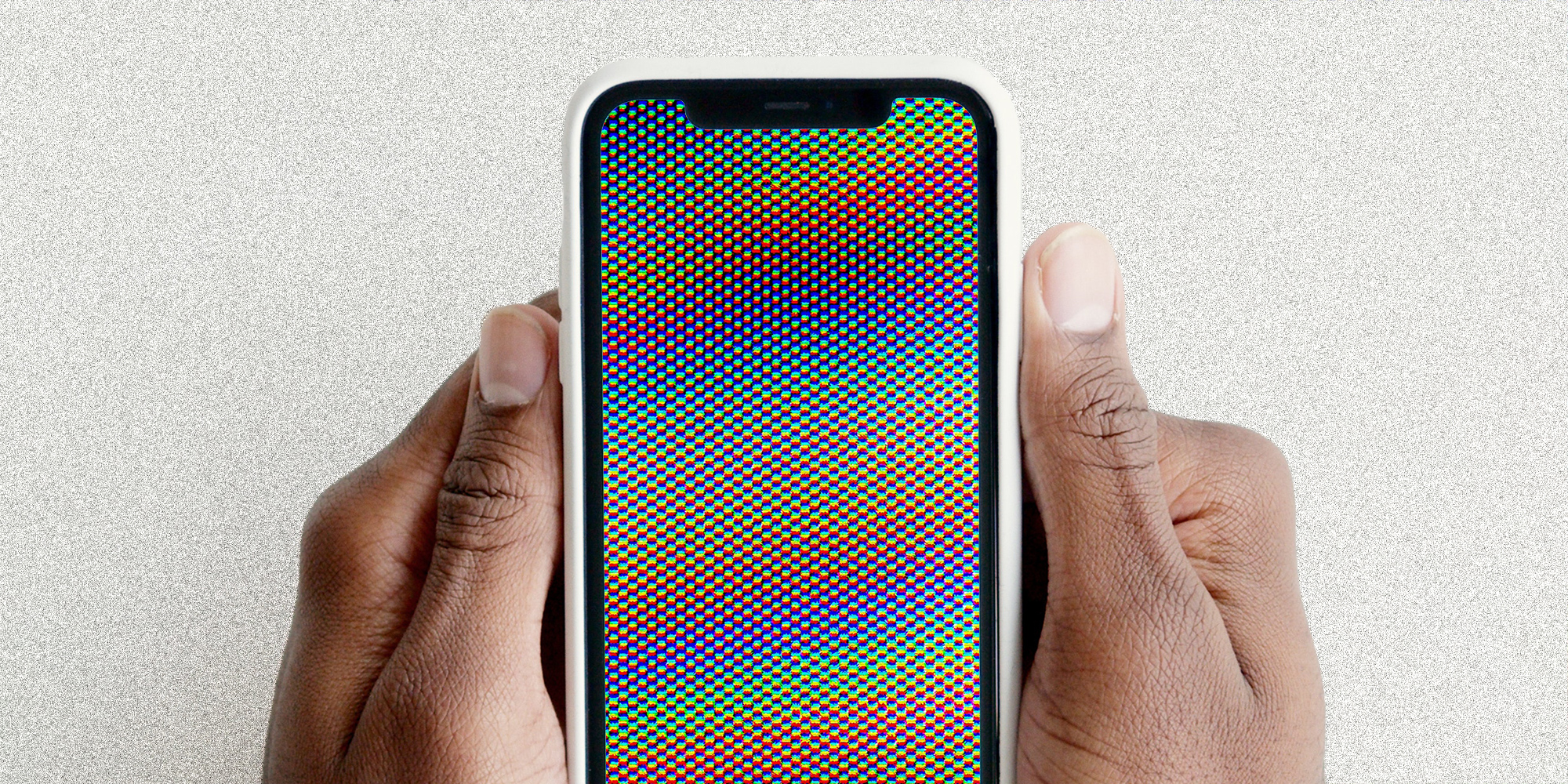 Hands holding an iPhone.