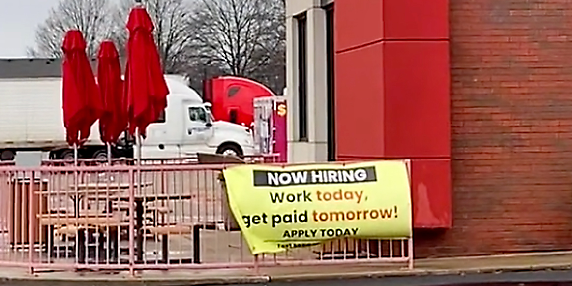 A sign outside a fast food restaurant.