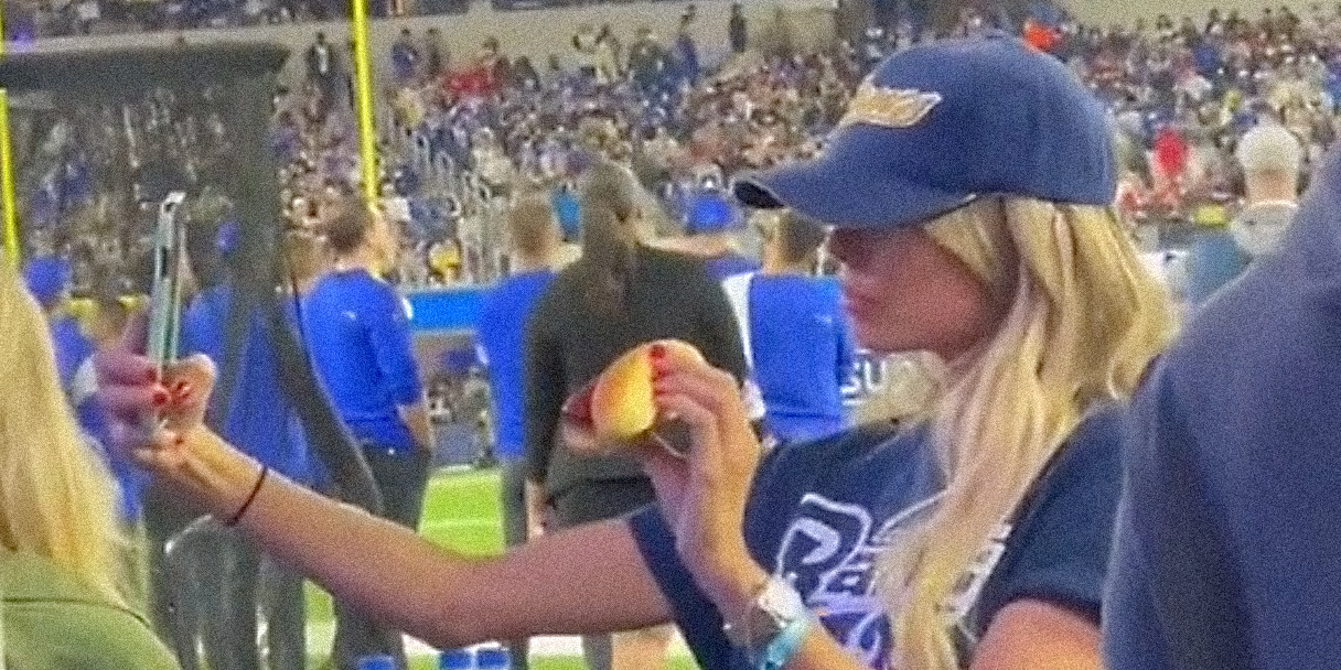 A woman with a hot dog.