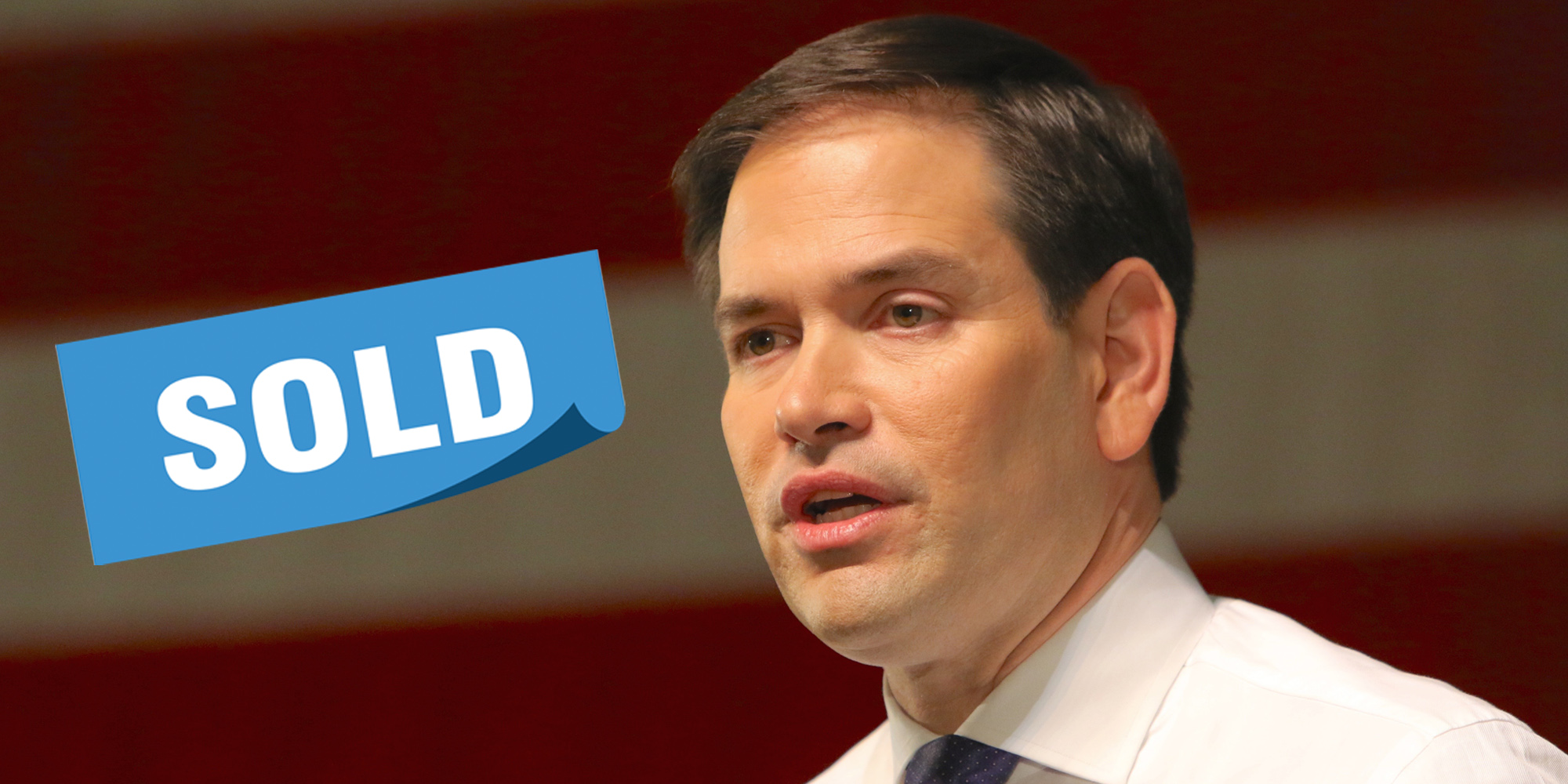 Marco Rubio speaking American flag blurred behind him blue "sold" rectangular banner left