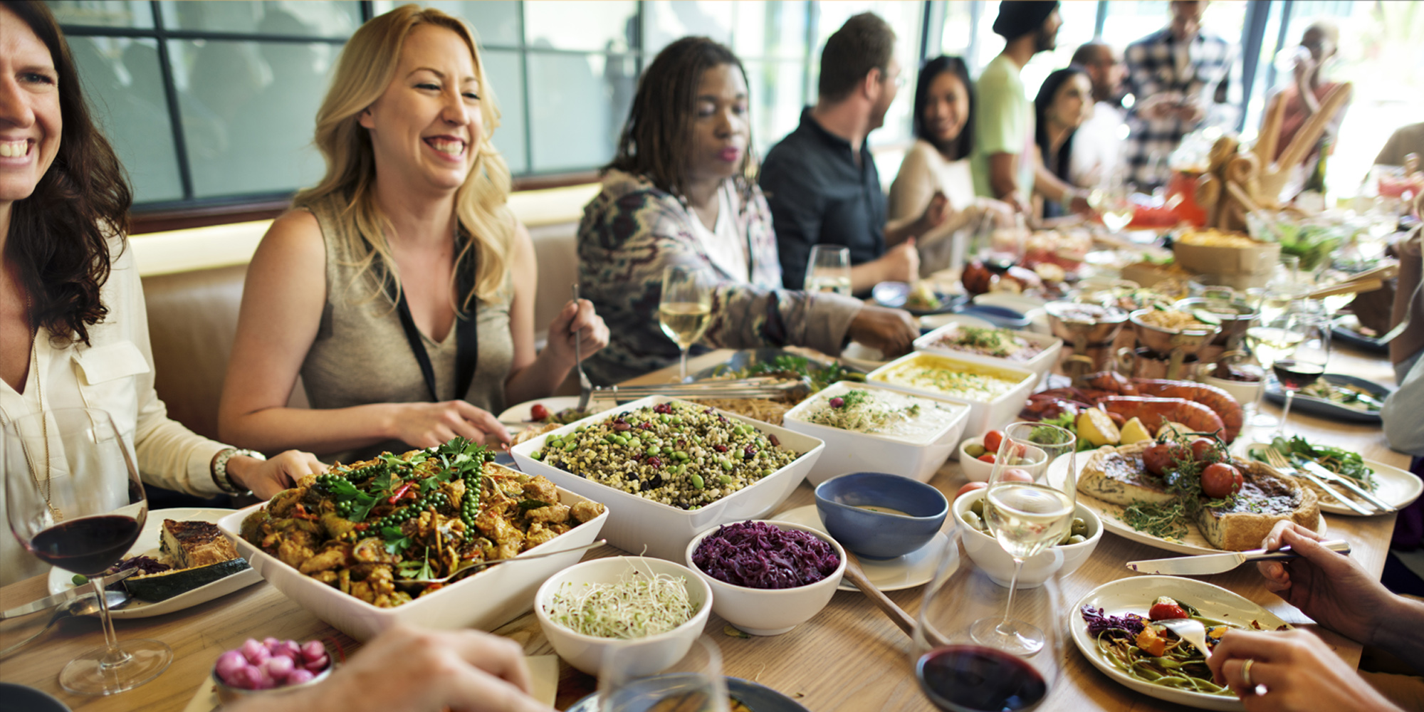 large group eating food on table