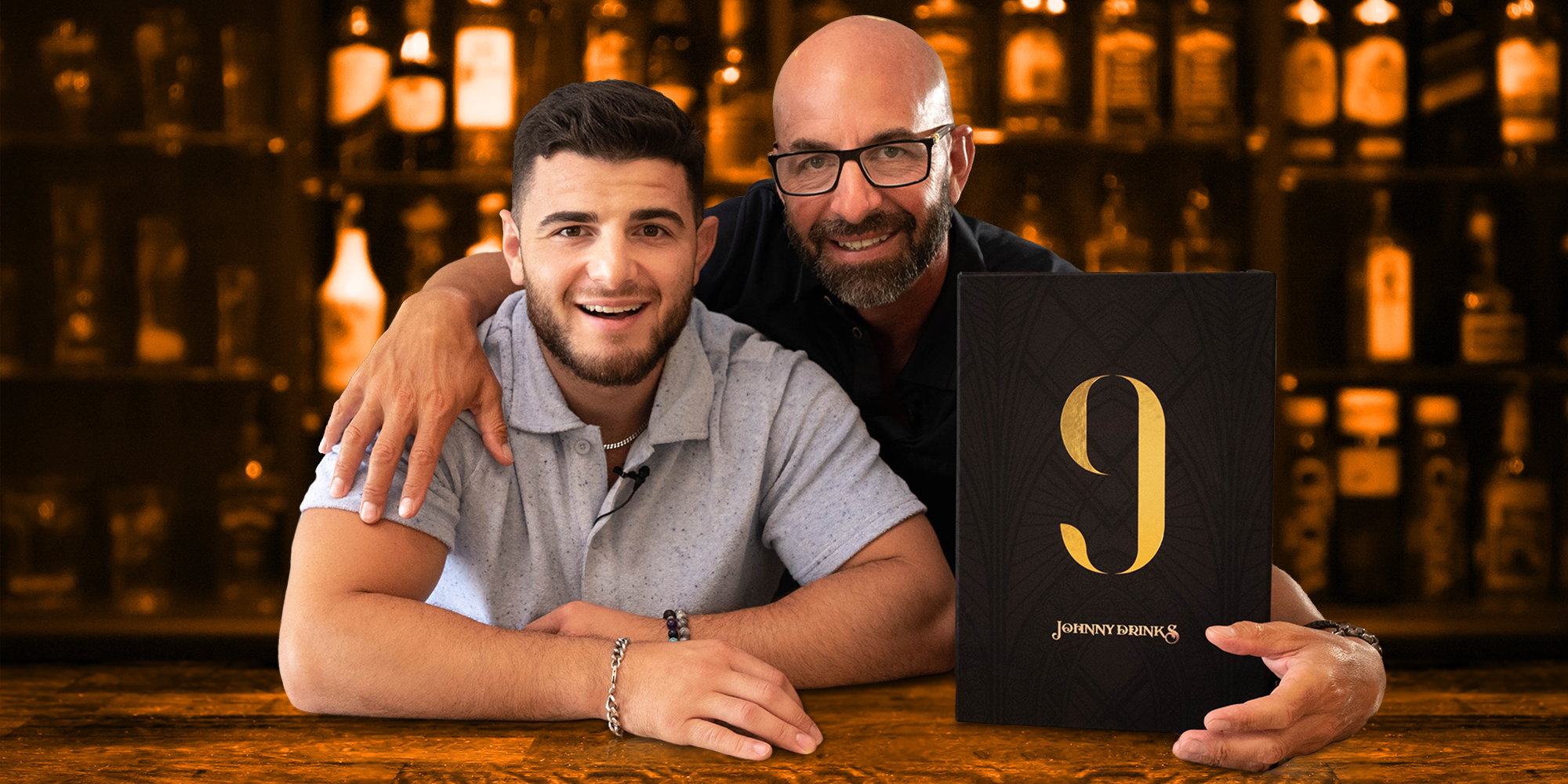 Two men at a bar with a plaque that reads "9 Johnny Drinks"