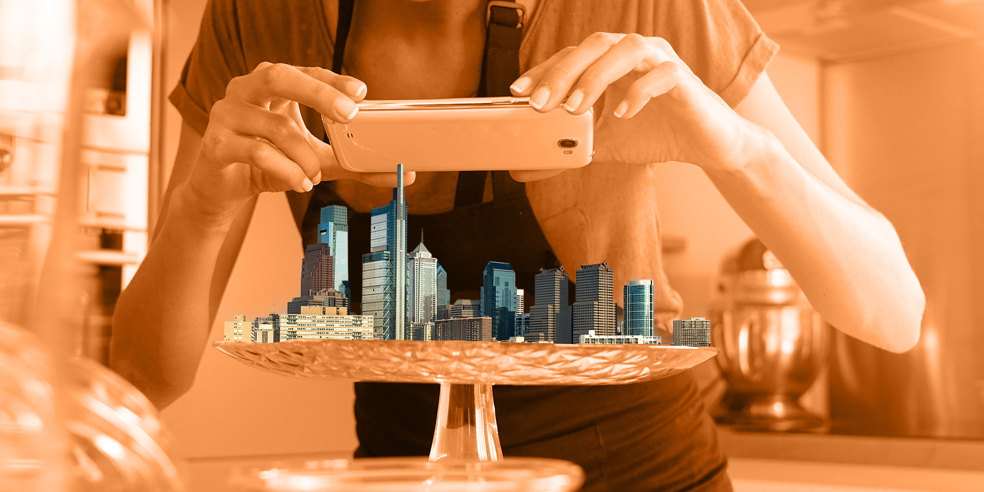 Blogger taking picture of Philadelphia skyling on platter