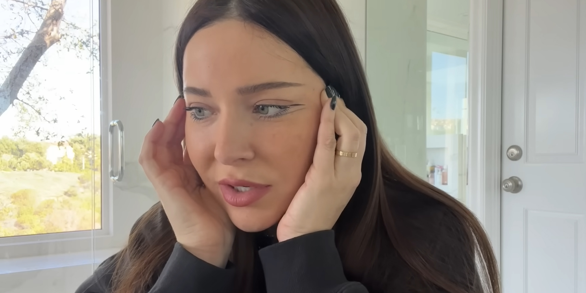 woman with hands on head