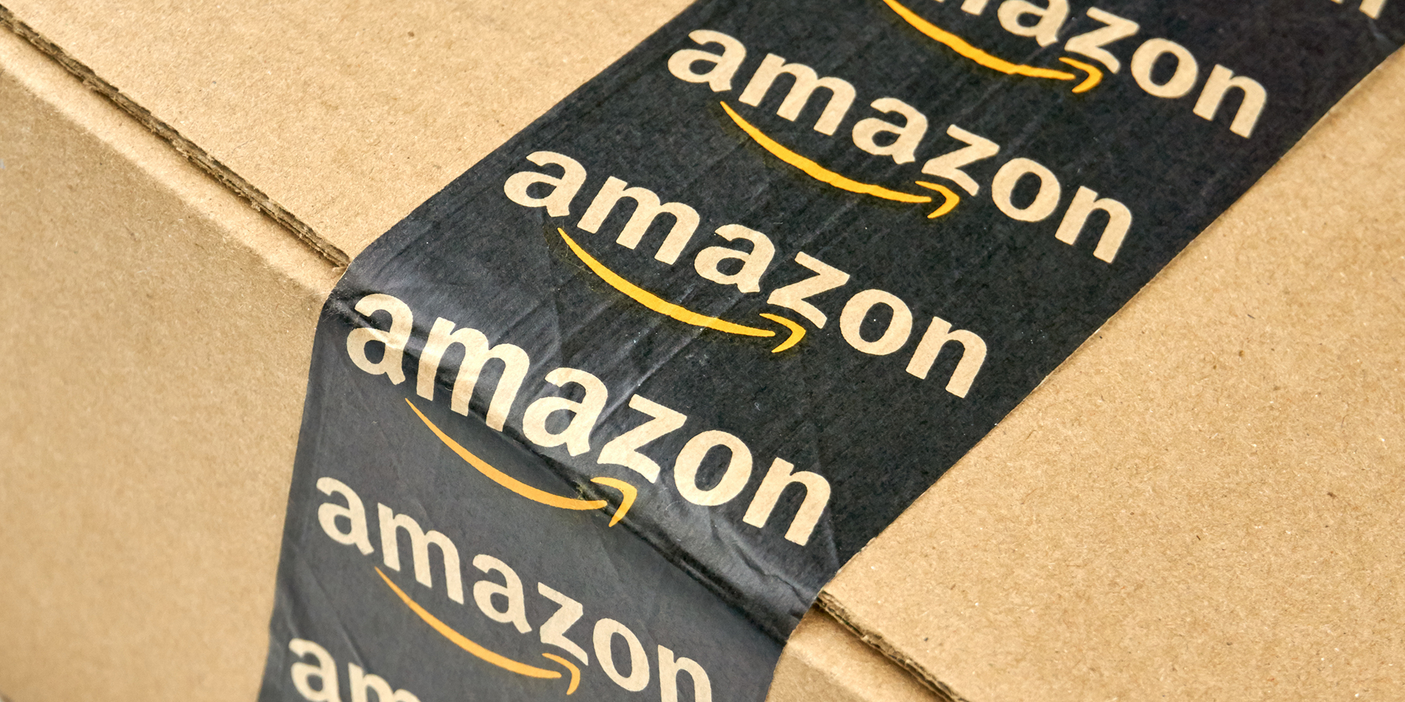 Amazon shipping box with branded tape on it