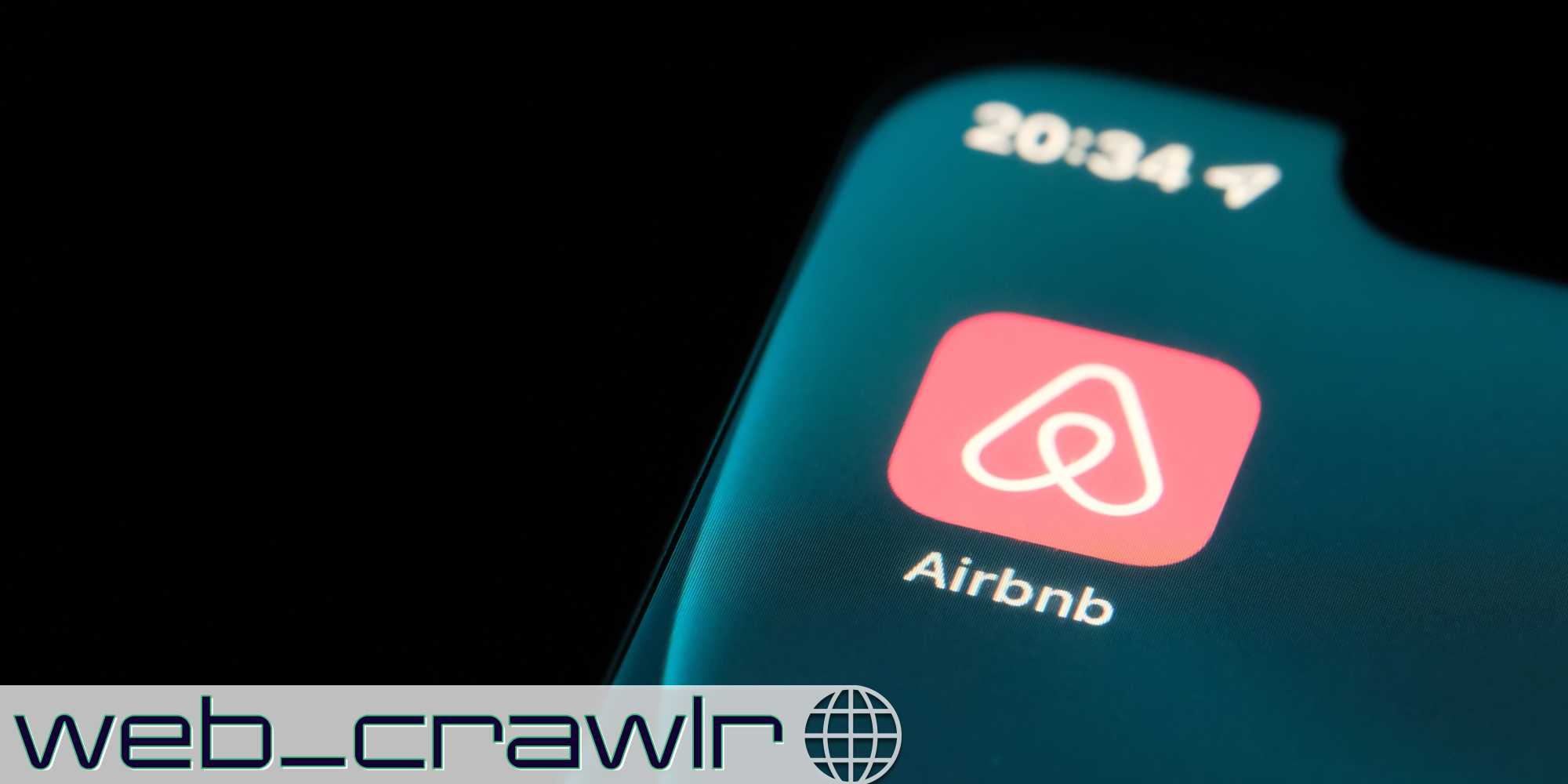 A phone with the Airbnb app on it. The Daily Dot newsletter web_crawlr logo is in the bottom left corner.