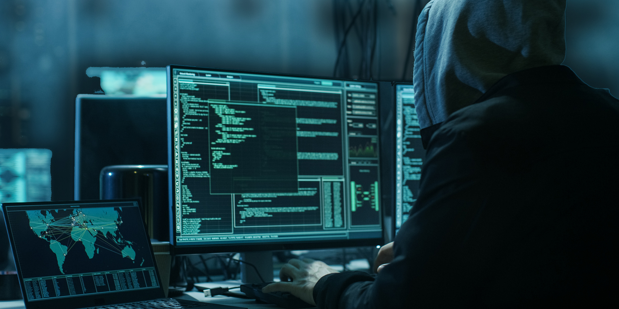 Dangerous Hooded Hacker Breaks into Government Data Servers and Infects Their System with a Virus. His Hideout Place has Dark Atmosphere, Multiple Displays, Cables Everywhere.