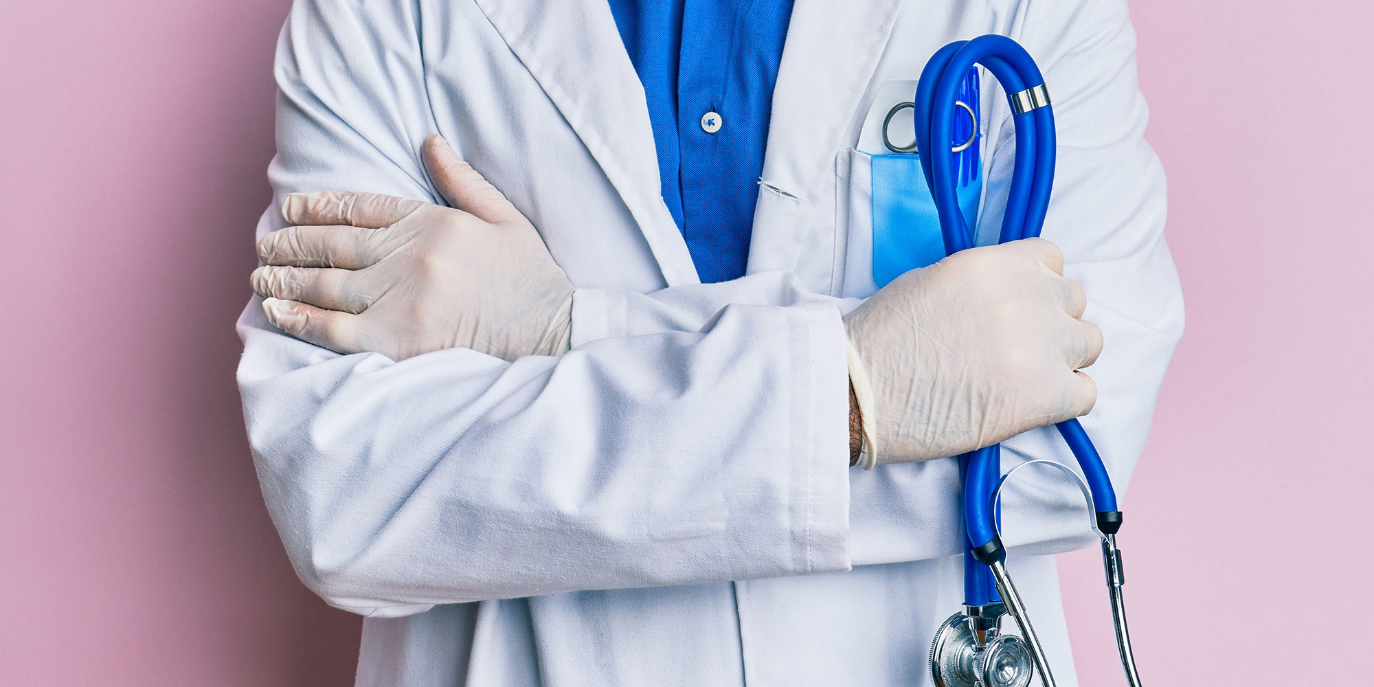 Middle age man wearing doctor uniform depressed and worry for distress, crying angry and afraid. sad expression.