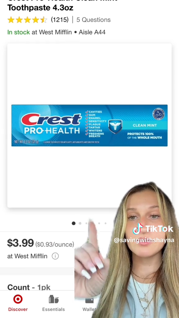 young woman pointing to crest box