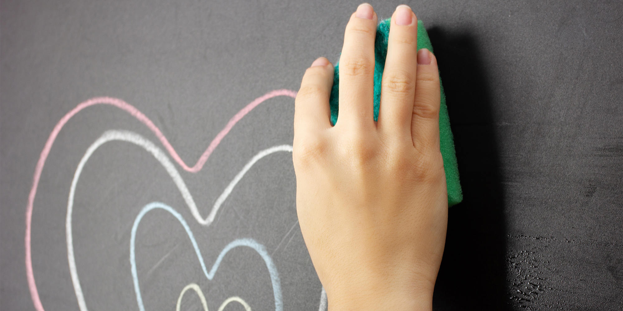 Woman's hand erases from the board