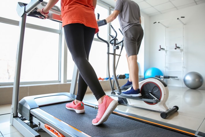 people training on machines in gym