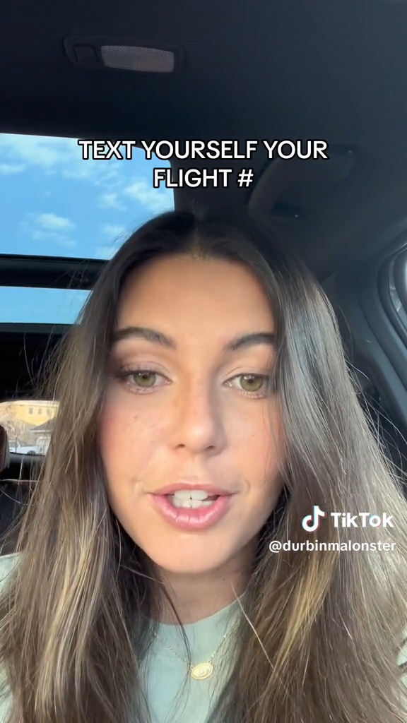 young woman in car with caption "Text yourself your flight #"