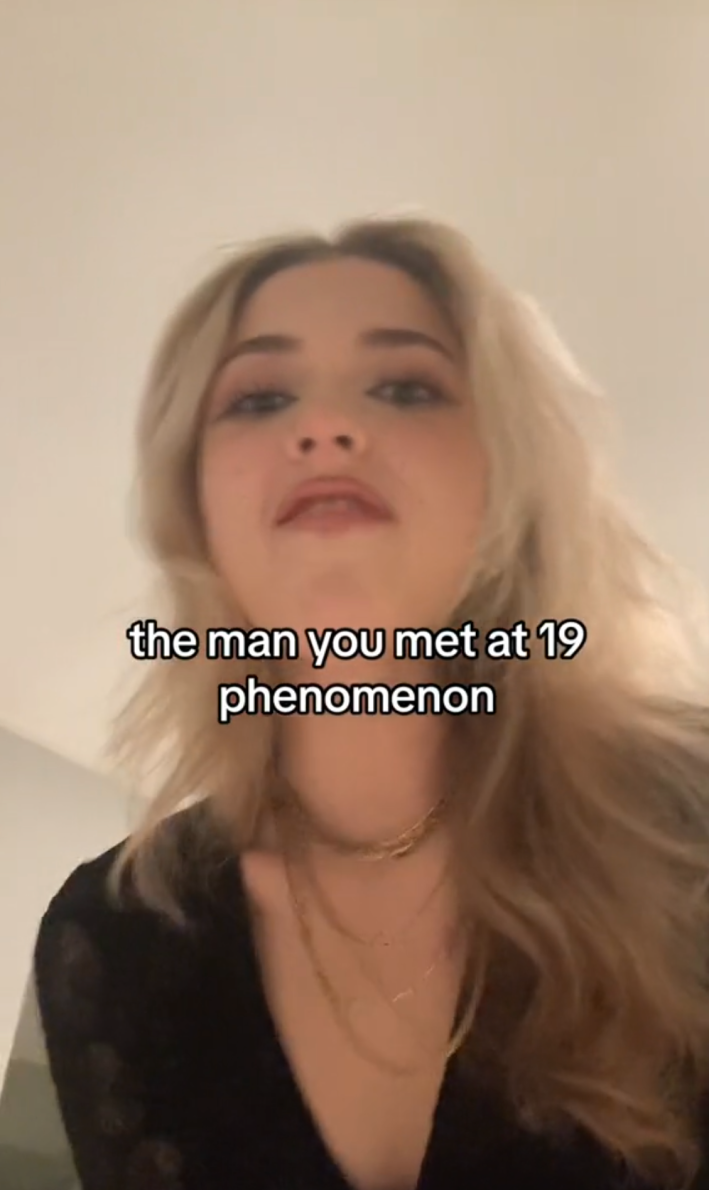 View of a woman staring down at the camera from above, looking very angry. Text overlay reads, "the man you met at 19 phenomenon"