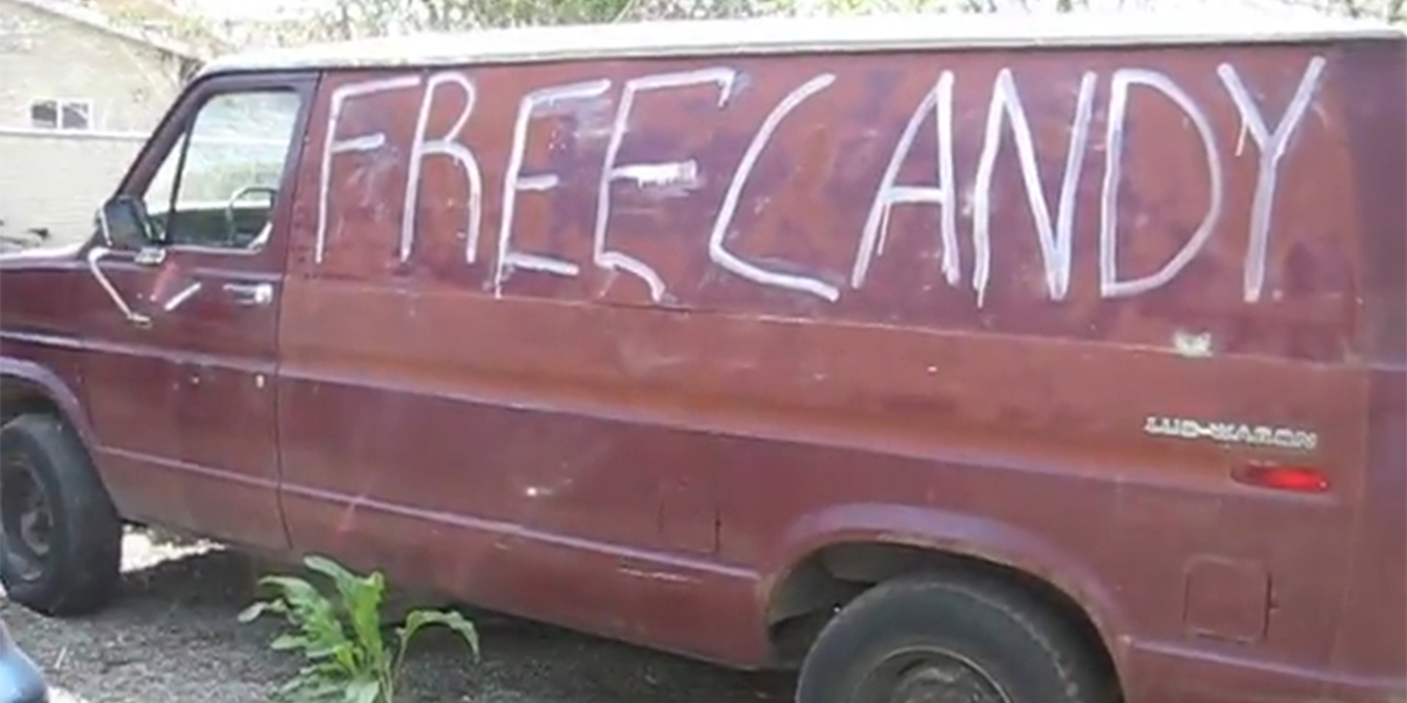 FREE CANDY written on red van