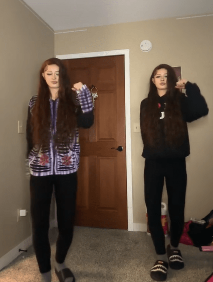 Screenshot of twins dancing in a corner of a room in response to white tube top girl's TikTok video