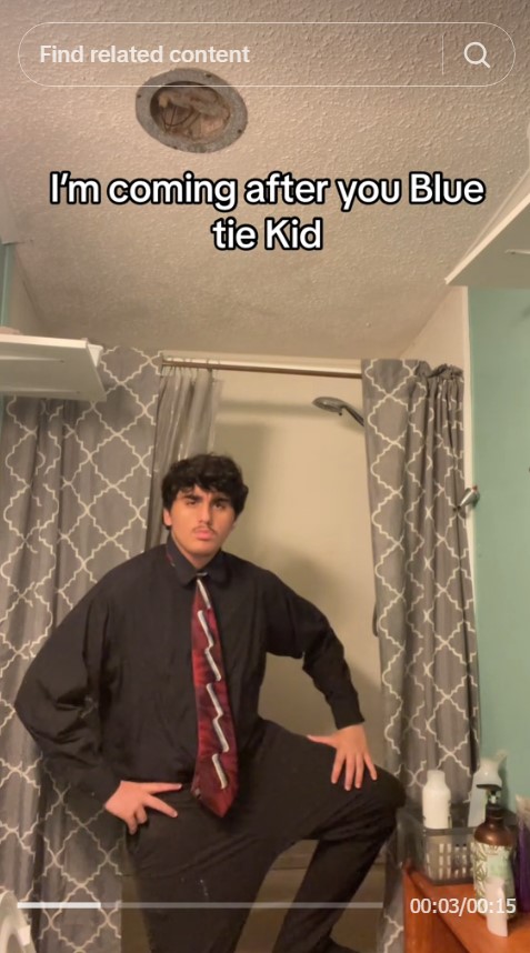 kid challenges blue tie kid