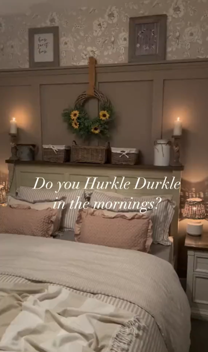 Aesthetic photo of a neatly-made cottagecore bed. Text overlay reads, "Do you Hurkle Durkle in the mornings?"