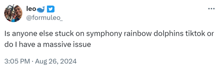 Tweet that reads, "Is anyone else stuck on symphony rainbow dolphins tiktok or do I have a massive issue."