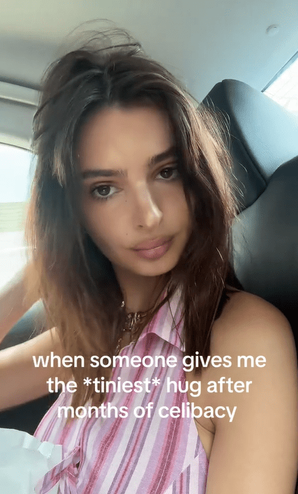 Boysober TikTok of a woman staring at the camera from the back of a car. Text overlay says, "when someone gives me the *tiniest* hug after months of celibacy."