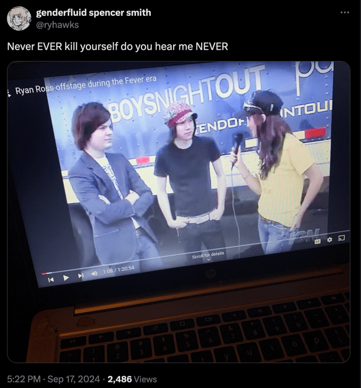 A X post depicting a laptop. On the laptop there is footage of a woman interviewing two men, presumably celebrities, on a step and repeat. The caption says "Never EVER kill yourself do you hear me NEVER"