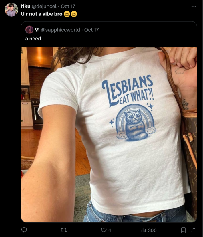 An X post subtweeting a woman taking a selfie wearing a shirt that says "Lesbians Eat What? and a scared kitten." The post is captioned "U R Not A Vibe Bro"