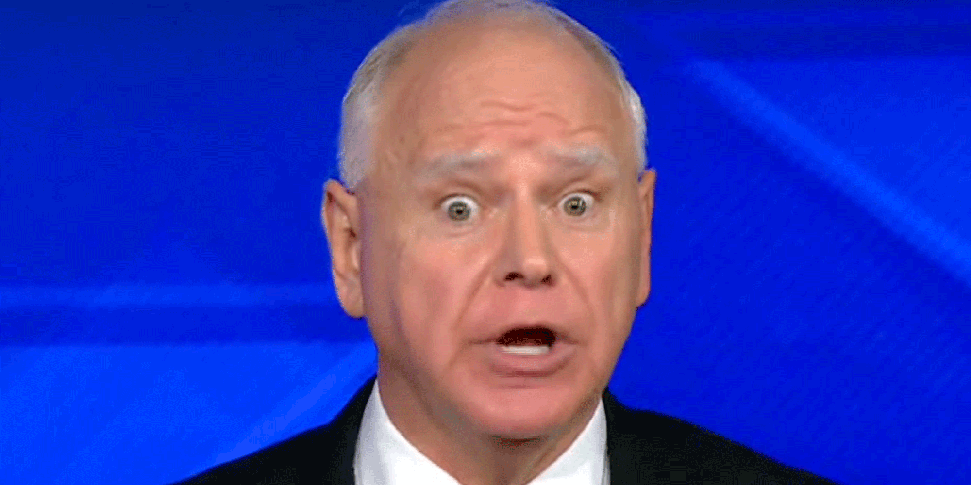 Vice presidential candidate Tim Walz showing a shocked expression.