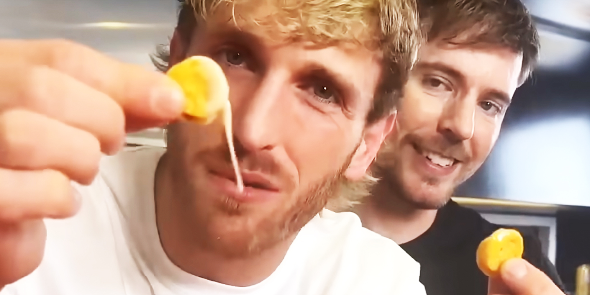 Logan Paul and MrBeast with cheesey chips
