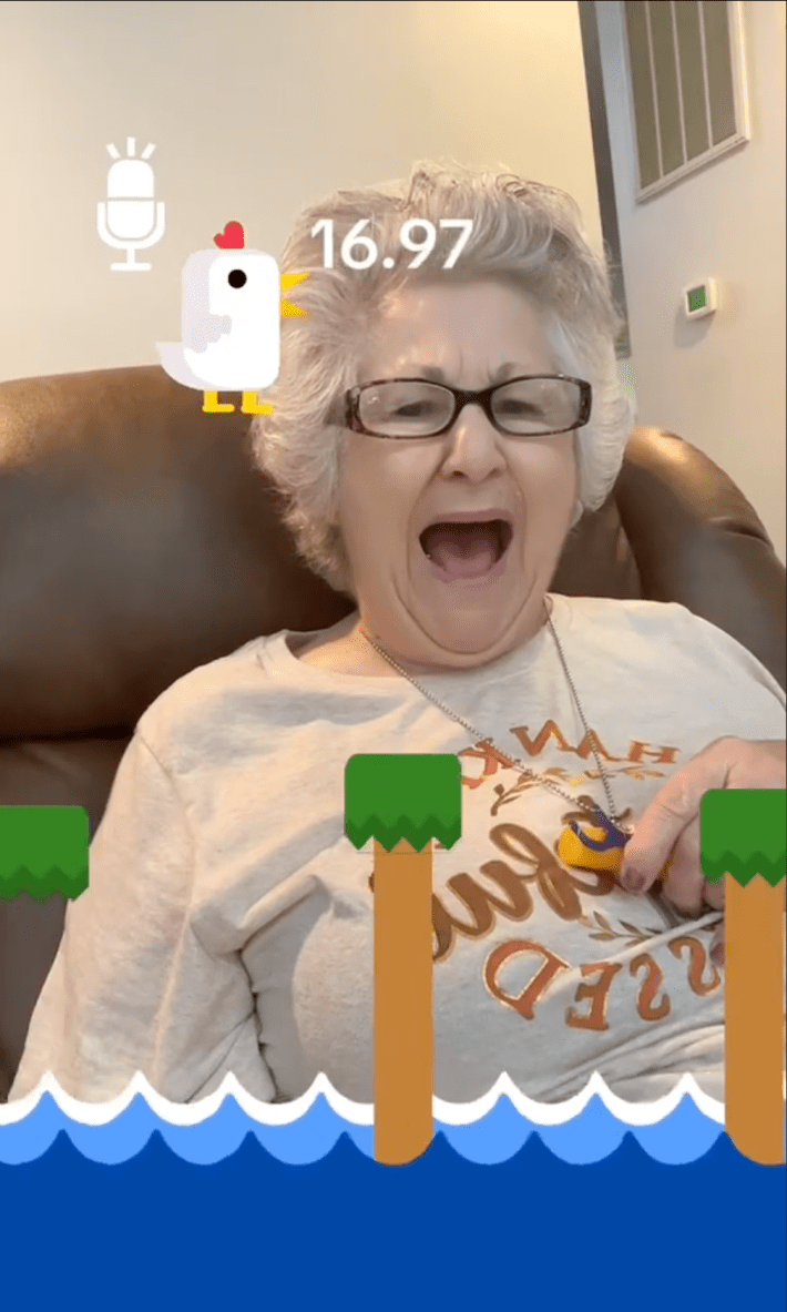An elderly woman participating in the Scream Chicken Game on TikTok.