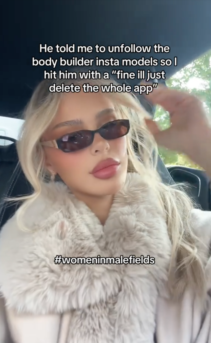 A TikTok video of a woman in her car, with the caption "he told me to unfollow the body builder insta models and I said fine i'd just delete the whole app. #Womeninmalefields"