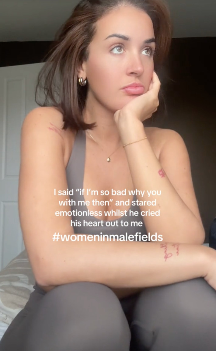 A TikTok video of a woman in workout clothes, with the caption "If I'm so bad why u with me then...etc. #Womeninmalefields"