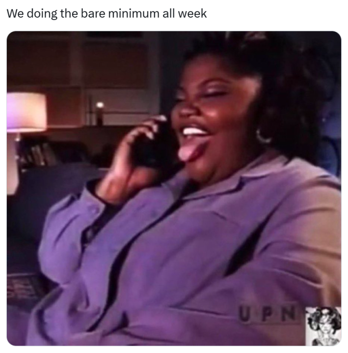 Funny Thanksgiving meme, text reads, "We doing the bare minimum all week" with a blurry photo of a Black woman laughing on the phone.