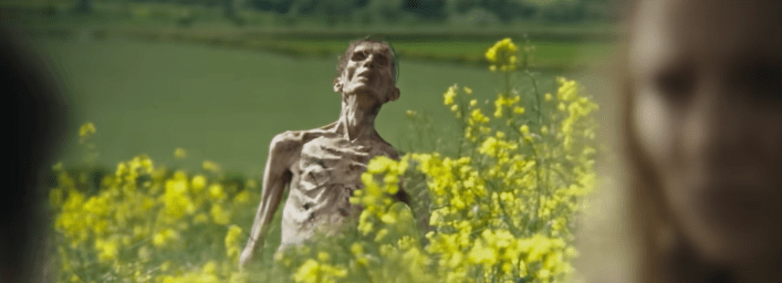A still from Sony Entertainment's "28 Years Later" where Zombie Cillian Murphy is rising from a field