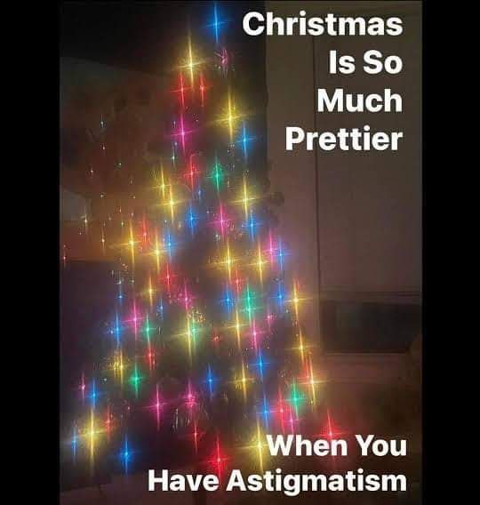 Christmas meme with a blurry lit Christmas tree, text reads, "Christmas is so much prettier when you have astigmatism."