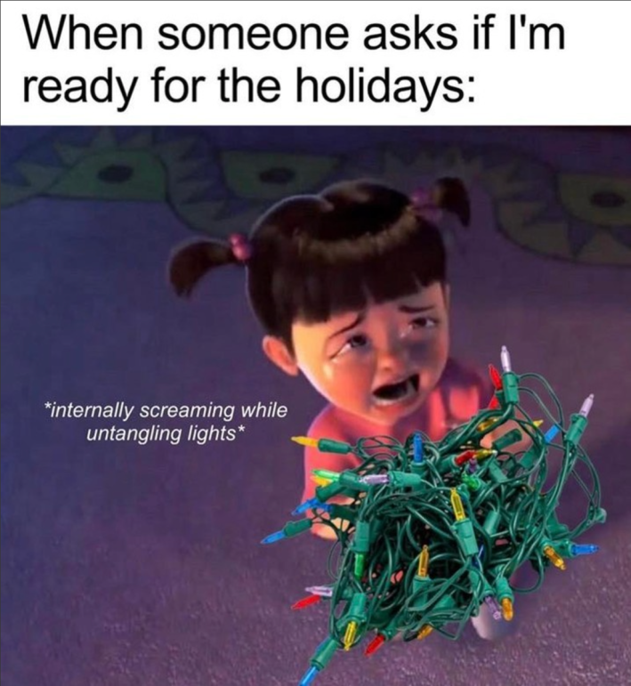 "When someone asks if I'm ready for the holidays:" Boo from Monsters Inc sobbing over tangled Christmas lights with the text "*internally screaming while untangling lights*"