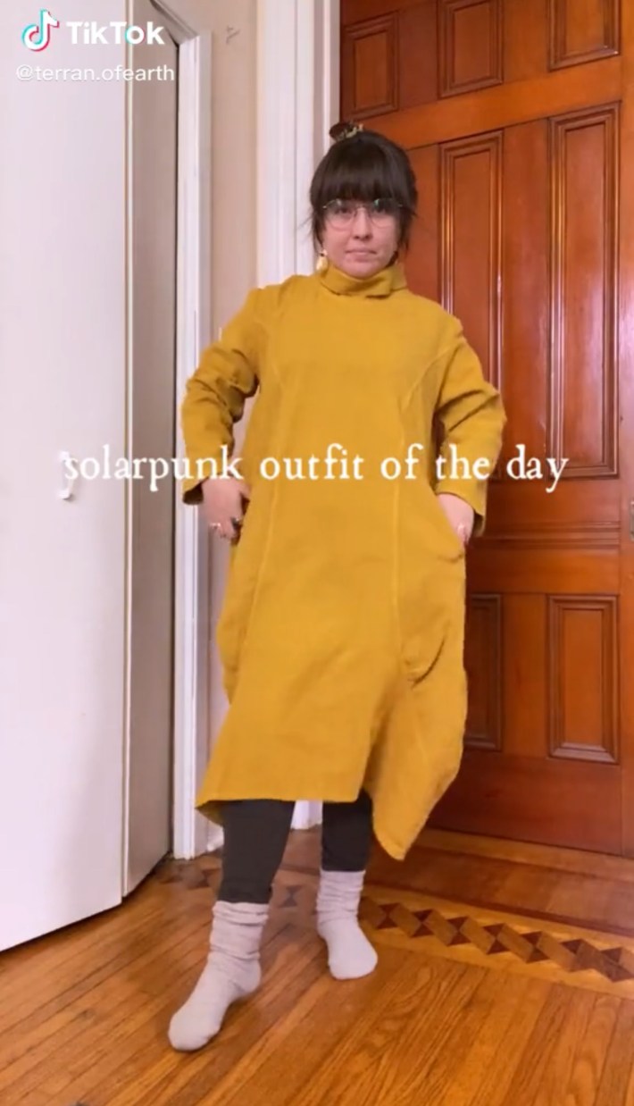 Person in yellow solarpunk dress