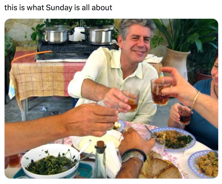 Sunday meme that reads, "this is what Sunday is all about" with a photo fo Anthony Bourdain clinking glasses with a group of people around a table.