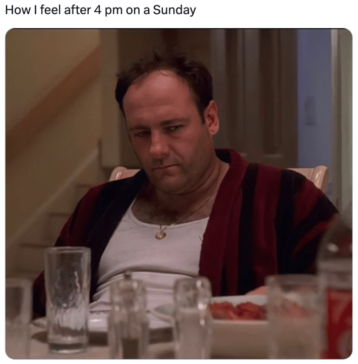 Sunday meme that reads, "How I feel after 4 pm on a Sunday" with a screencap of a man looking exhausted and side-eyeing his table.