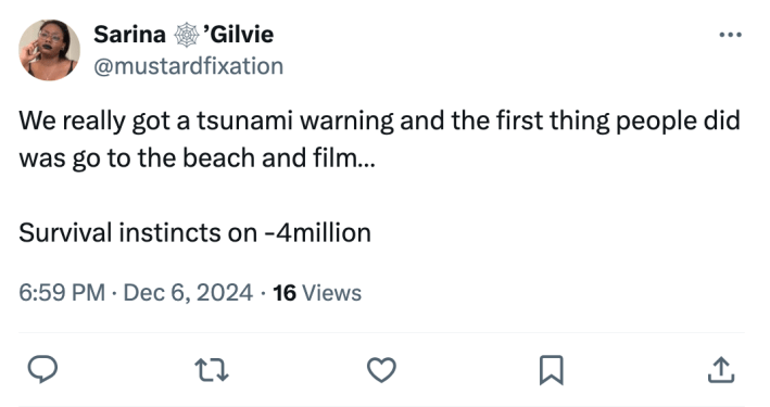 Tweet that reads, "We really got a tsunami warning and the first thing people did was go to the beach and film… Survival instincts on -4million"