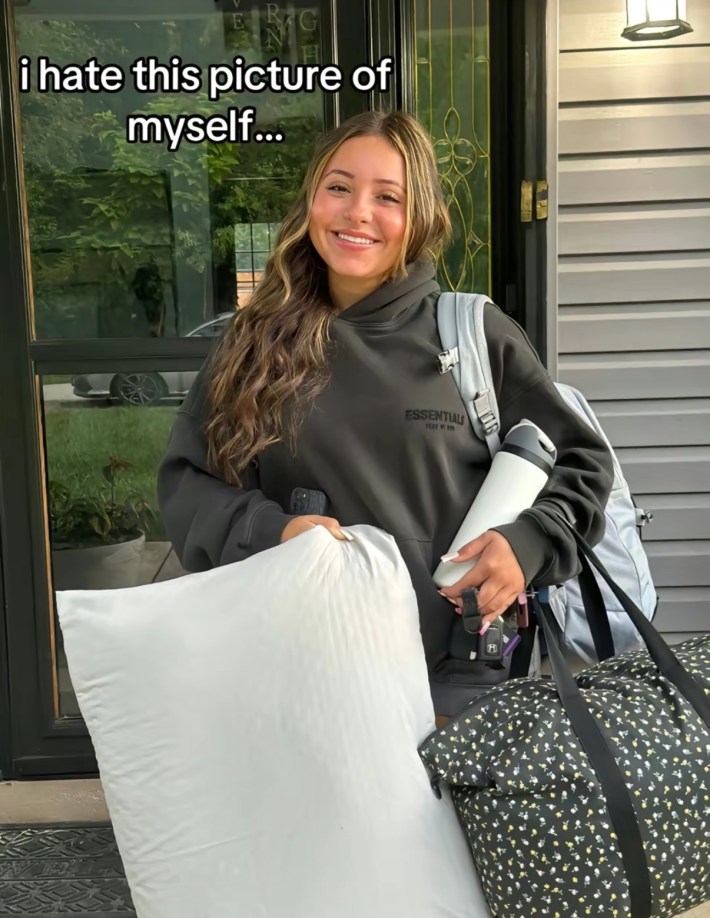 TikTok photo of a young woman smiling for the camera. Text overlay reads, "I hate this picture of myself..."