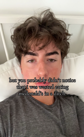 TikTok photo of a young man in bed staring blankly at the camera. Text overlay reads, "but you probably didn't notice that i was wasted eating mcdonald's in a ditch."