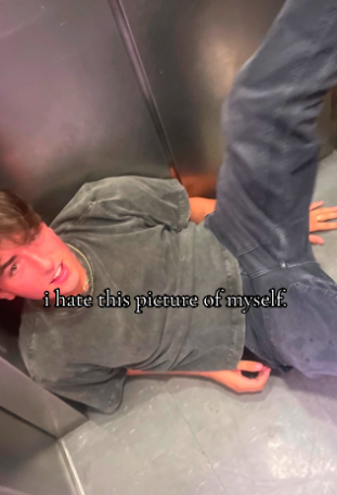 TikTok photo of a college guy drunk on the floor of an elevator. Text overlay reads, "I hate this picture of myself."
