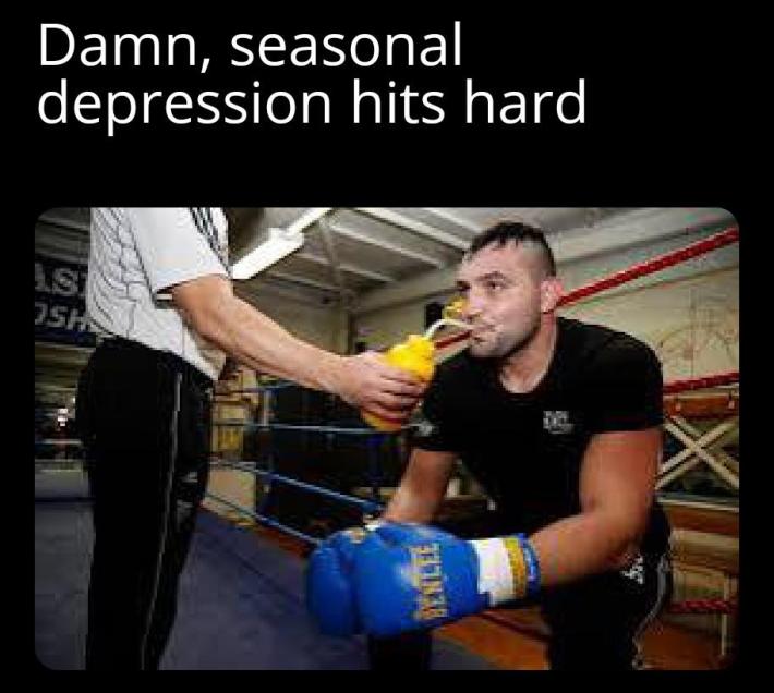 January meme, text reads, "Da**, seasonal depression hits hard" with a photo of a boxer in the ring drinking some water.