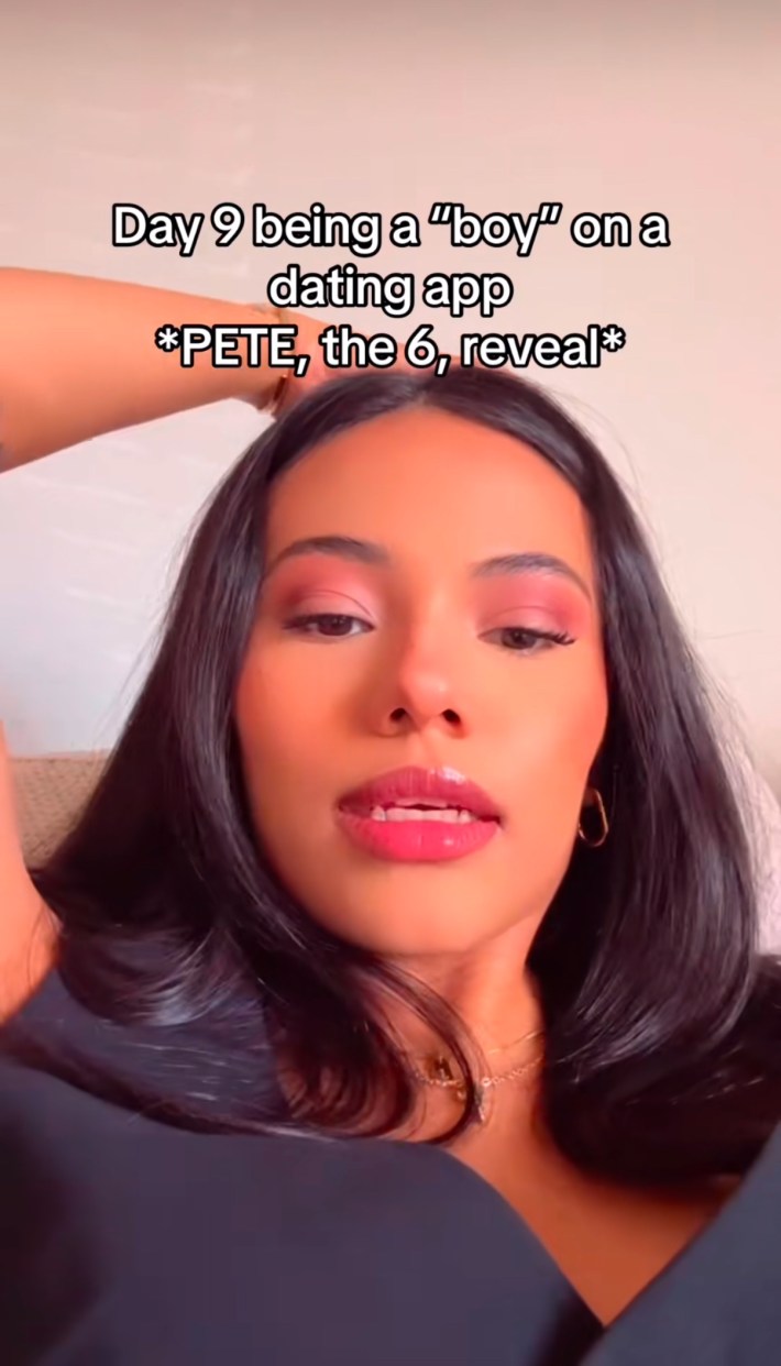 TikTok video of a woman sitting down, her hand raised to her head. Text overlay reads, "Day 9 of being a 'boy' on a dating app. *PETE, the 6, reveal*"